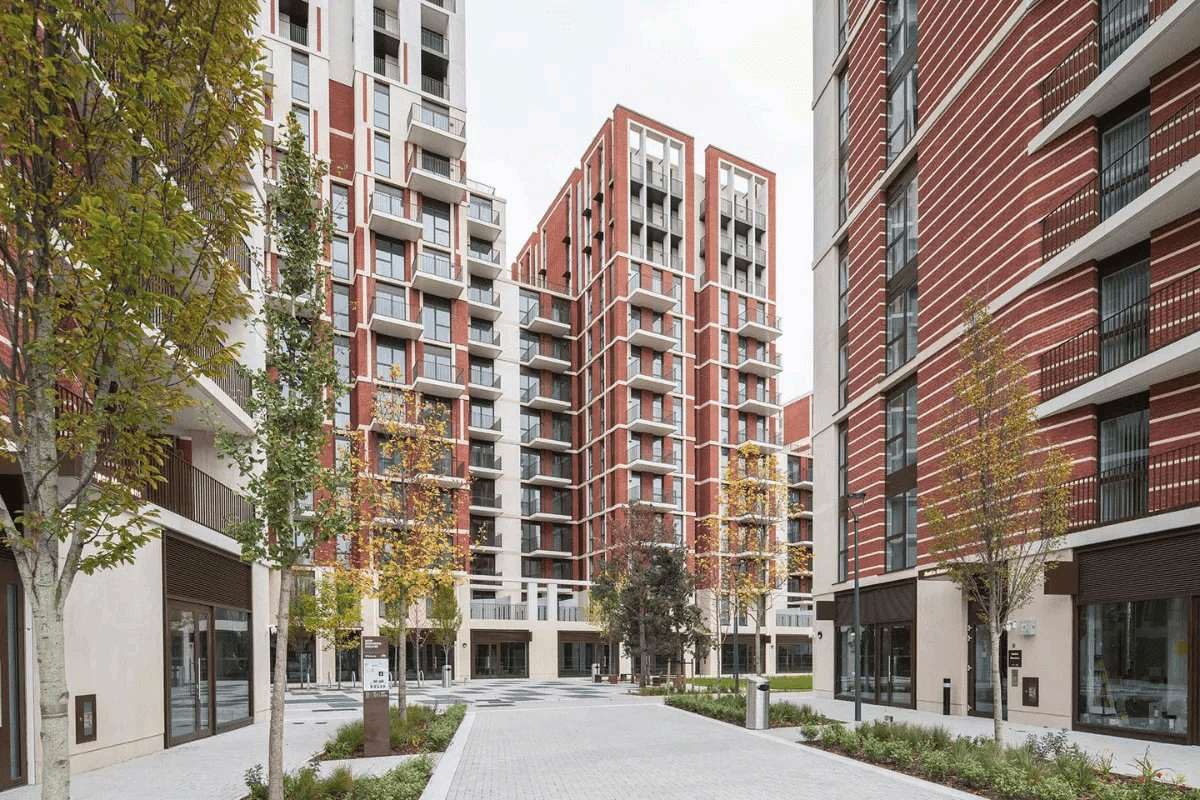 Street view of the red-brick residential towers at New Mansion Square, Battersea